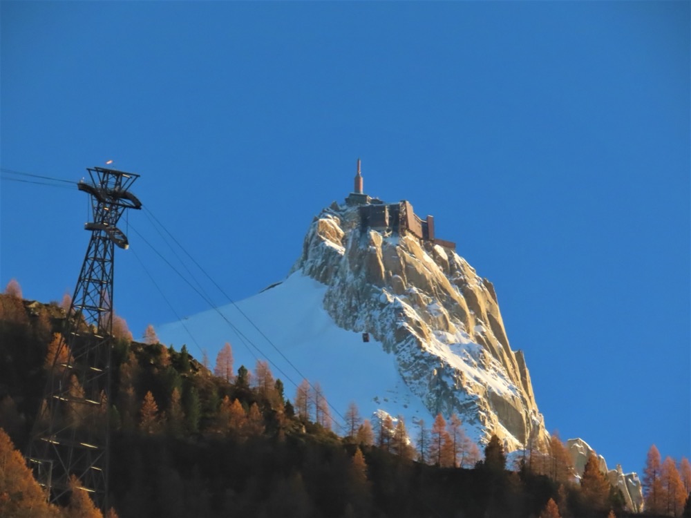 The cable car pylon and the summit station of the Aiguille du Midi