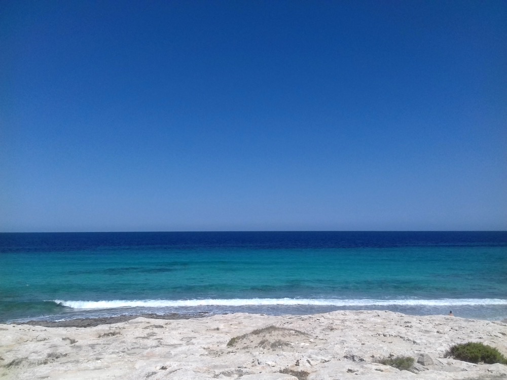 Turquoise water and a white sand shore at Ses Illetes, Formentera