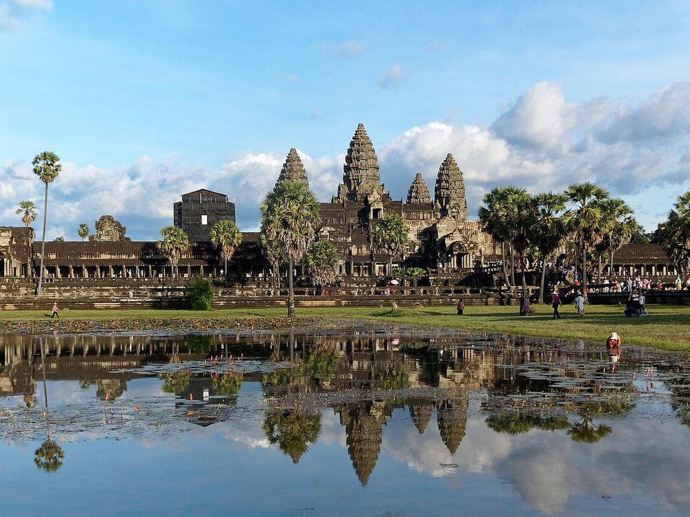 Angkor Wat reflected in its moat at dawn