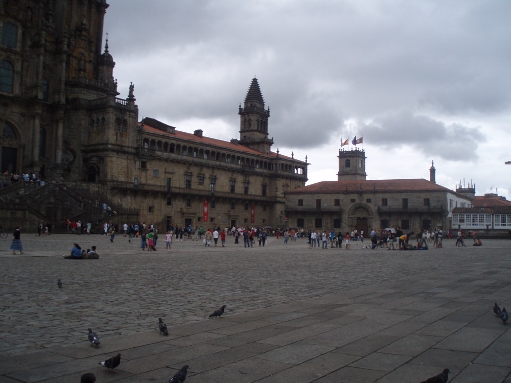 The Praza do Obradoiro in Santiago de Compostela with pilgrims resting on the stones