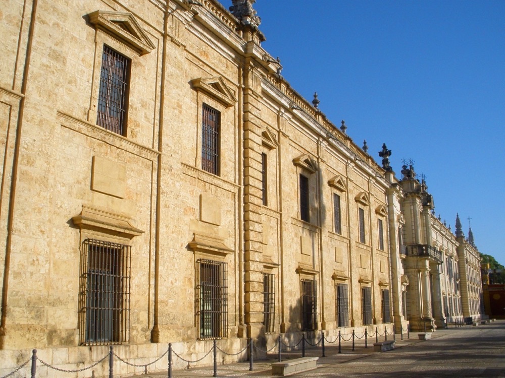 The long stone facade of the Real Fábrica de Tabacos, University of Seville