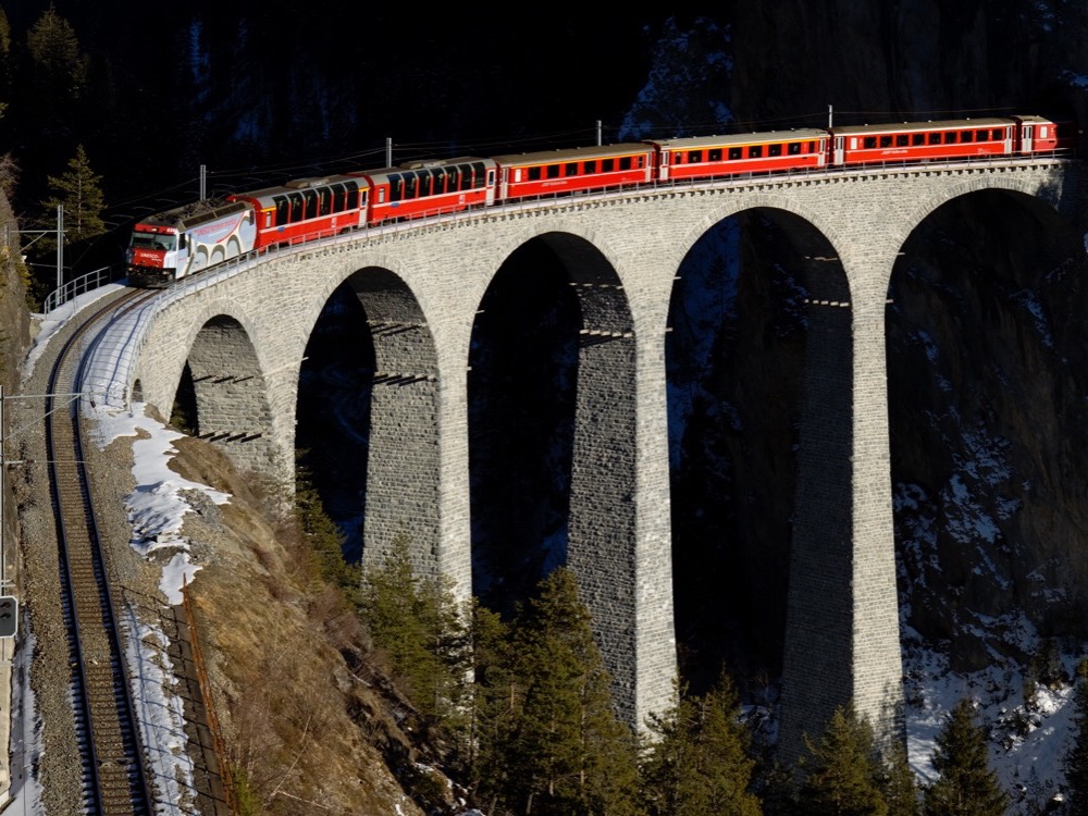A Rhaetian Railway train crossing the Landwasser viaduct in Switzerland