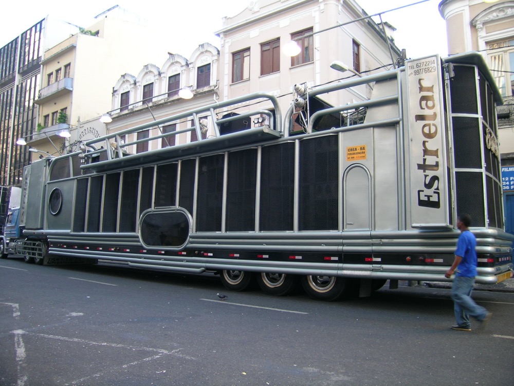 A trio elétrico truck parked in a street in Salvador during carnival