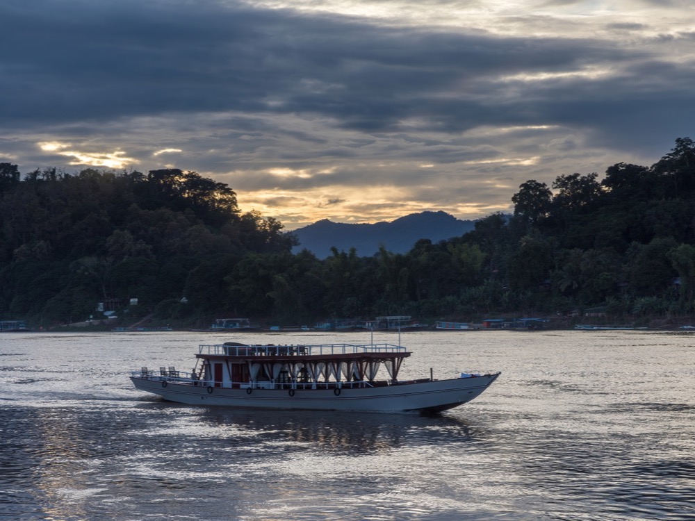 Boats on the Mekong at sunset in Luang Prabang
