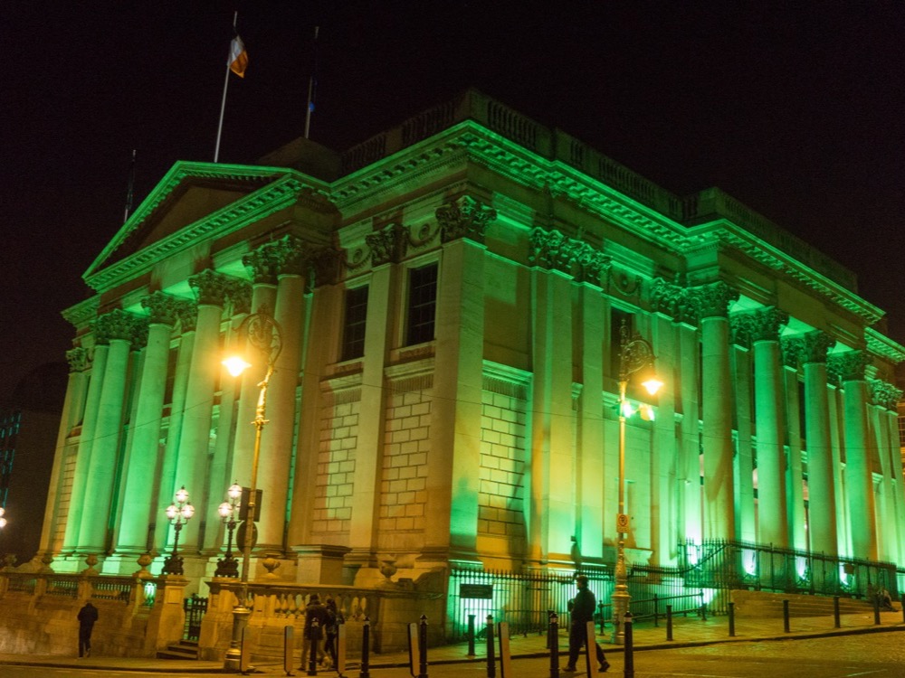 Dublin City Hall lit green at night during St Patrick's Festival