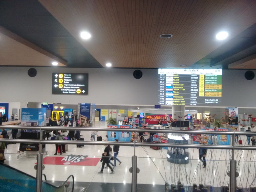 The arrivals hall at Larnaca Airport, Cyprus, with flight boards and car hire desks